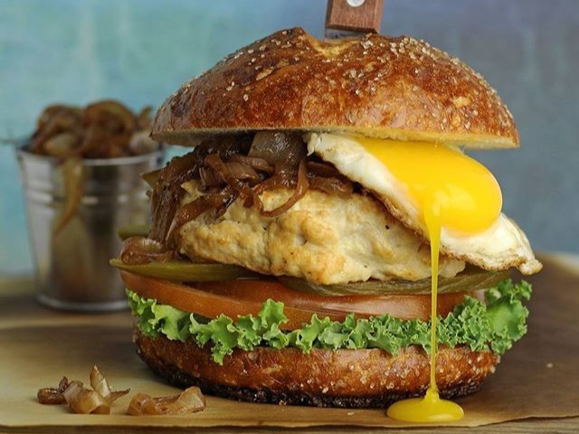 burger on brown wooden table